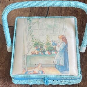 Vintage Joan Walsh Anglund illustrated sewing basket with blue trim.